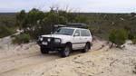19-Bundy climbs a border track dune